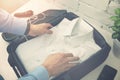 Man packing travel suitcase for business trip Royalty Free Stock Photo