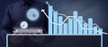 Businessman With A Tablet Showing Click Cursor S And Presenting Crucial Graphs With A Futuristic Design. Man In A
