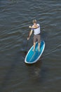 Man paddleboarding, overhead shot Royalty Free Stock Photo