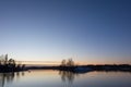 Man paddling in the Baltic Sea on cold December evening