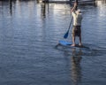 Man paddling and enjoying the morning breeze at the Santa Barbara marina, California Royalty Free Stock Photo