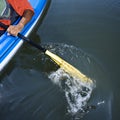 Man paddling kayak.