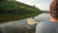 Man paddling in kayak on calm waters of the Ugra-river in Russia.