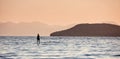 A man paddling on a paddleboard in the open sea Royalty Free Stock Photo