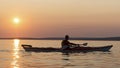 Man Paddling Sea Kayak on Georgian Bay at Sunset Royalty Free Stock Photo