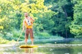 Man paddling on SUP in river