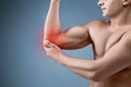 Man With Pain In Elbow. Pain relief concept