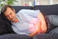 Man in pain feeling stomachache after heartburn Royalty Free Stock Photo