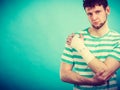 Man with painful bandaged hand. Royalty Free Stock Photo