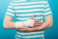 Man with painful bandaged hand. Royalty Free Stock Photo