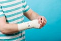 Man with painful bandaged hand. Royalty Free Stock Photo