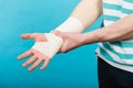 Man with painful bandaged hand. Royalty Free Stock Photo