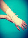 Man with painful bandaged hand. Royalty Free Stock Photo