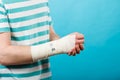 Man with painful bandaged hand. Royalty Free Stock Photo