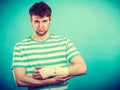 Man with painful bandaged hand. Royalty Free Stock Photo