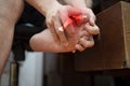 Man with painful and inflamed gout on his foot Royalty Free Stock Photo