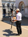 Man paint a mounted trooper of the Life Guards on duty