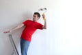 Man painted wall and falls from ladder while making repairs to building. insurance and threat to life during Royalty Free Stock Photo