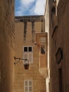 Man painting balcony roof in Malta