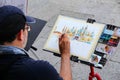 Man painting Basilica of Saint Mark at Piazza San Marco in Venice, Italy Royalty Free Stock Photo