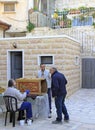 Man is painting decorative installation outdoor in Jerusalem