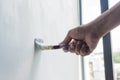 Man painting the house wall with brush wooden Royalty Free Stock Photo