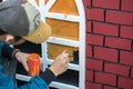 Man painting play house made of styrofoam closeup