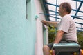 Man painting wall with a roll Royalty Free Stock Photo