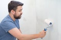 Man painting wall roller with white paint Royalty Free Stock Photo