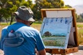 Man painting at an easel