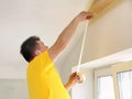 Man Applying the Painting Tape Royalty Free Stock Photo