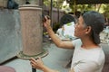 Man paints traditional tribal tattoo motives decoration, Kuching, Malaysia.