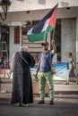 Man with the Palestine flag at the pro-Palestine and anti-Israel protest rally at Tunis.