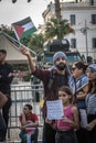 Man with the Palestine flag at the pro-Palestine and anti-Israel protest rally at Tunis.