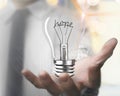 Man palm holding light bulb with hope word wire shapes Royalty Free Stock Photo