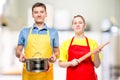 a man with a pan and a woman with a rolling pin portrait Royalty Free Stock Photo
