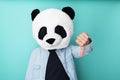 Funny man in panda mask with thumbs down gesture