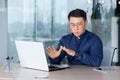 Man panic attack at work, office worker worried breathing hard, asian man depressed and sad thinking, businessman at Royalty Free Stock Photo