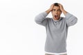 Man in panic grab his head and shouting pressured, losing money, facing huge problem, standing troubled and intense with