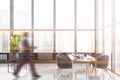 Man in panoramic dining room with blue chairs Royalty Free Stock Photo