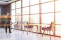 Man in panoramic gray restaurant interior Royalty Free Stock Photo