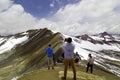 Man with panoramic view. Hiking scene in Vinicunca, Cusco region, Peru. Montana of Seven Colors, Rainbow Mountain