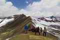 Man with panoramic view. Hiking scene in Vinicunca, Cusco region, Peru. Montana of Seven Colors, Rainbow Mountain Royalty Free Stock Photo
