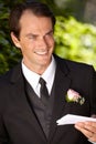 Man, paper and outdoor at wedding marriage for commitment ceremony, promise speech or romance party. Male person, vows Royalty Free Stock Photo