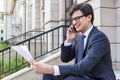 Man with paperwork on phone Royalty Free Stock Photo
