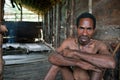 Man of Papuan Korowai tribe in the house on a tree Royalty Free Stock Photo