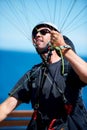 Man, parachute and paragliding launch in air in nature, exercise and healthy adventure fof extreme sport. Person, glide