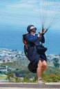 Man, parachute and paragliding launch in air in nature, healthy adventure and fun in extreme sport. Athlete, take off or Royalty Free Stock Photo