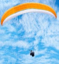 Man, paragliding and blue sky adventure in clouds for explore city, outdoor courage or fearless athlete. Male person
