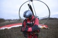 Man paramotorist preparing the paramotor for flight